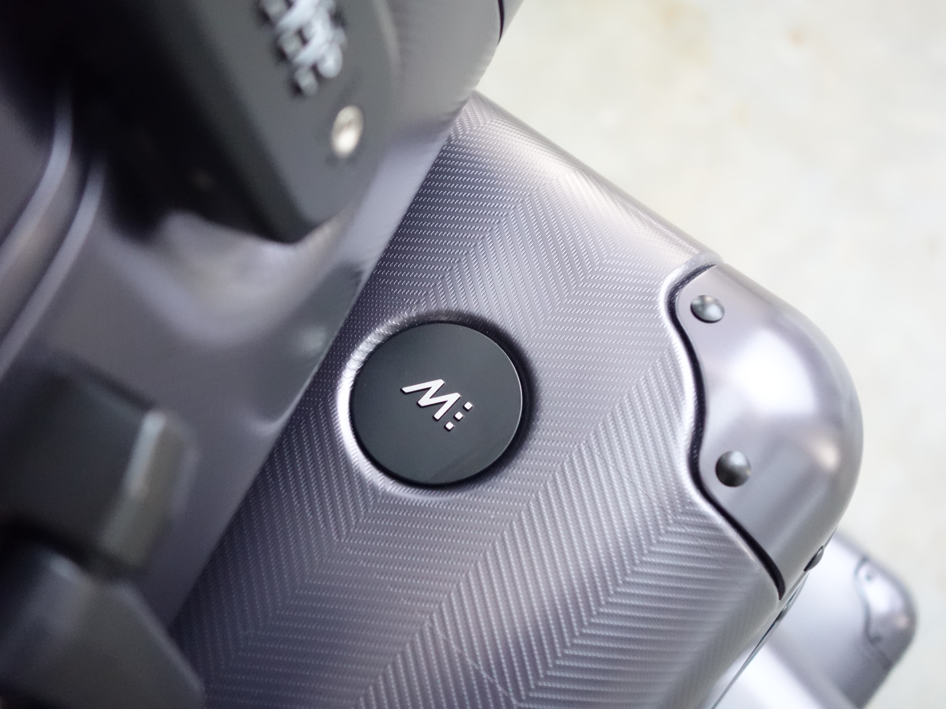 Monos aluminum luggage texture